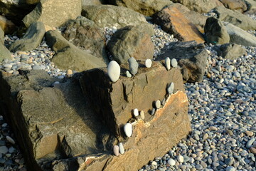 Background from a stone of igneous rock. Wallpaper made of textures of boulders of volcanic origin....