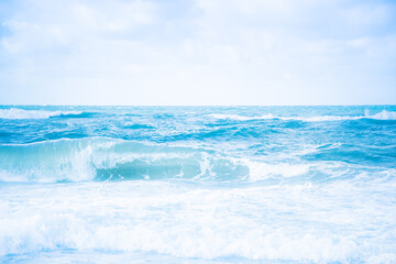 Naklejka na ściany i meble Blue Ocean with waves and clear blue sky