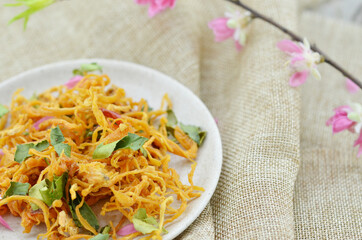 White plate with dried chicken