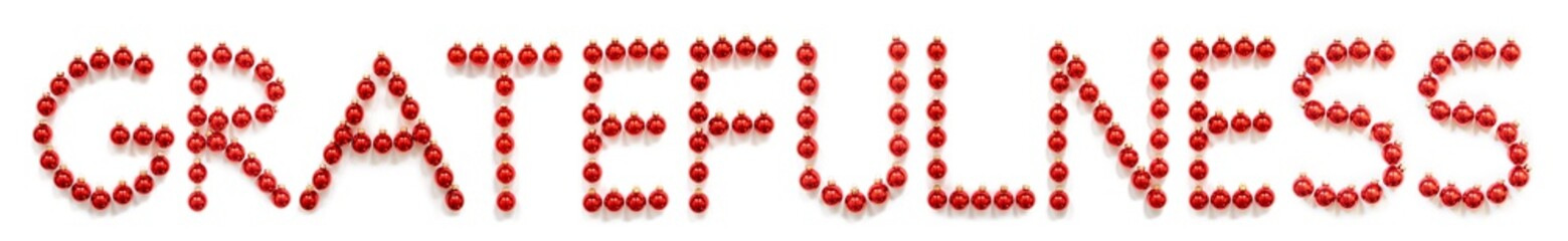 Red Christmas Ball Ornament Building English Word Action. Festive Christmas Decoration. White Isolated Background