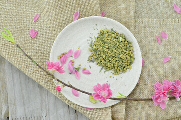 Peach flower and white plate with rice tea