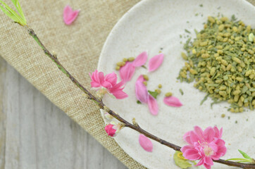Peach bud and flower blooming with rice tea for lunar new year
