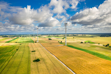 Wind turbines on green field, Poland, aerial view