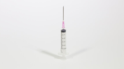 Syringe closeup isolated on white background