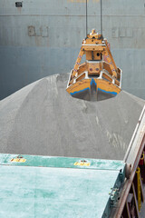 Loading and dischargind operation of bulk cargo bauxite on bulk carrier ship using grab bucket/