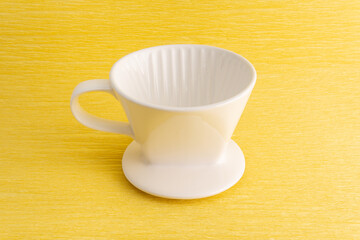 Drip brewed  coffee on yellow background 