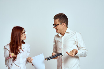 business man and woman secretary documents employees colleagues on light background cropped view
