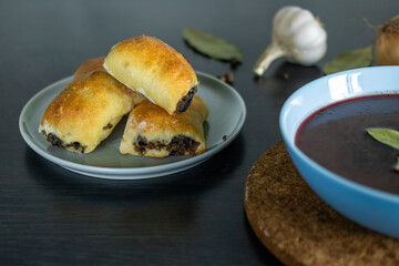 Yeast patties with buckwheat and mushrooms, served with borscht