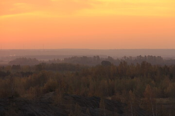 Orange sunrise in golden autumn