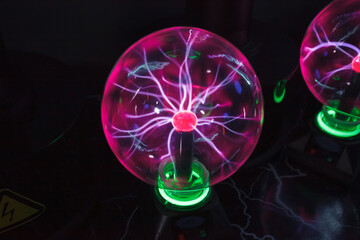 Glass ball with plasma Tesla lightning bolts.