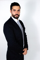 Handsome young man with beard in suit. Attractive stylish businessman. Medium shot. White background.