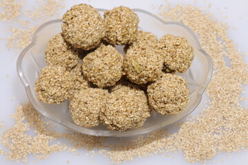 Organic natural Til Gul OR Sesame seeds over white background