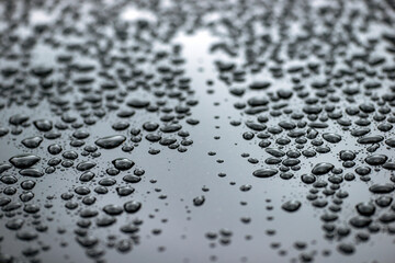 water drops on a metal surface, sweden, nacka, stockholm, sverige