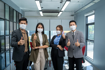 Group of business people wear mask for protect Covid-19 have a meeting and talking in the office.