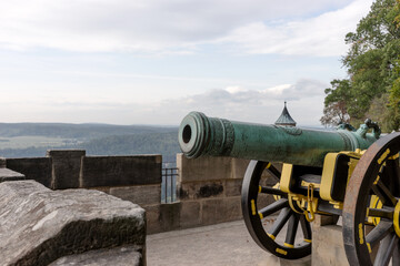 Cannon on the defensive walls on the Medieval Königstein Fortress, located on a rocky hill above the Elbe River in Saxon Switzerland. Germany