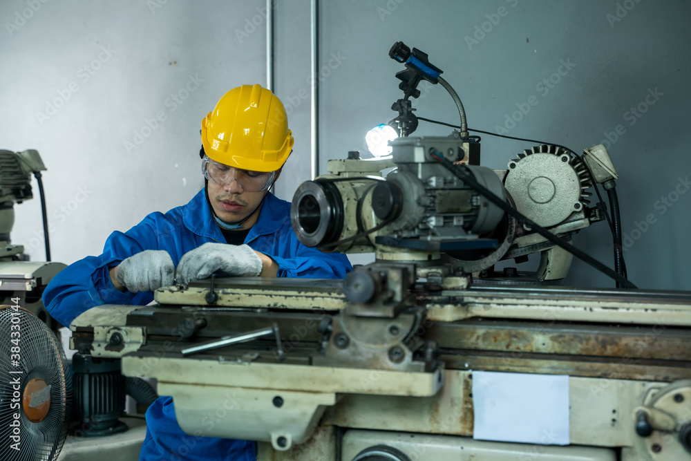 Poster Factory worker are working on projects at machine for steel structure industry.