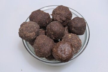 Nachni laddu or Ragi laddoo or balls made using finger millet on white background