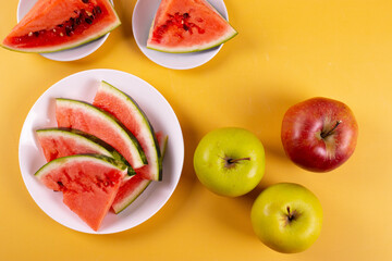 fresh and ripe watermelon on yellow background. minimalism style