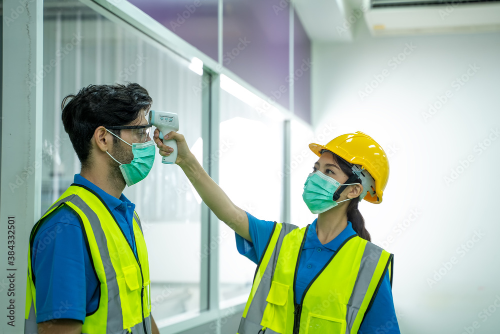 Aufkleber industrial worker scan temperature before working at factory to protect infection from coronavirus c