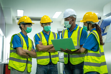Group Industrial worker wear protective face masks for safety working at industrial factory.