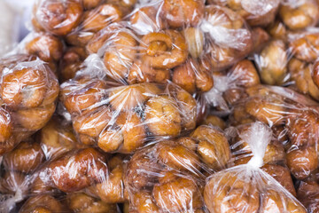 Africa street food fried cakes in plastic bag packages for safe sale and consumption
