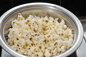 Heap of salted popcorn, isolated on white background.