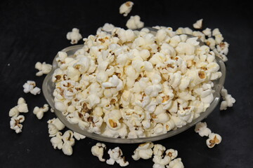 Heap of salted popcorn, isolated on white background.