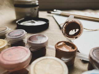 Colors acrylic paints in small jars