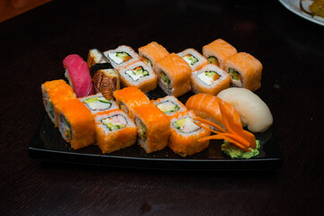 Sushi roll set on black plate