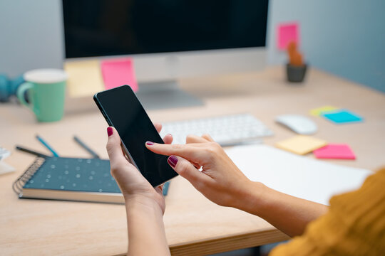 cell phone Mockup image black screen. Woman hands holding texting using mobile on desk. background empty space for advertise text. People contact marketing business, technology.