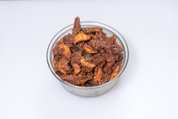 Dry hot spicy red chillies with garlic curryon white background 