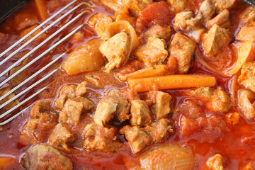 goulash with carrots in a pan