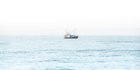 Fishing boat in the middle of the sea
