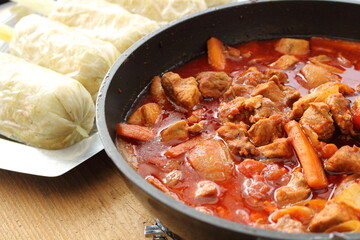 Goulash with bread dumplings in a pan