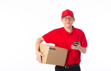 young Asian delivery man in red uniform, carry cardboard box in hands isolated on white background.