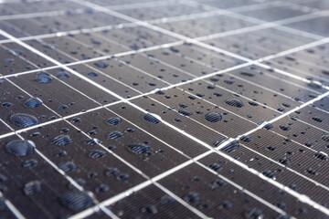 Solar panels on a construction site with raindrops on them