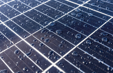 Solar panels on a construction site with raindrops on them