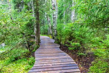 Park with the cascades of Akparhvenkoski waterfalls on the Tokhmayoki River, a popular tourist attraction situated near the settlement Ruskeala in Karelia, Russia