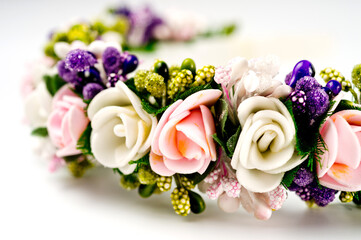 Hair hoop decorated with delicate color artificial flowers.