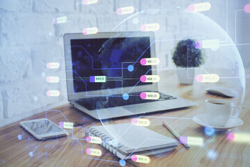 Double exposure of laptop computer and technology theme hologram. Concept of freelance work.