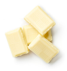 Heap of white chocolate isolated on white, from above