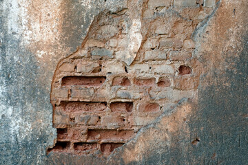   Masonry of red clay ceramic bricks. The walls are subject to destruction in time. Masonry pattern and wall surface      