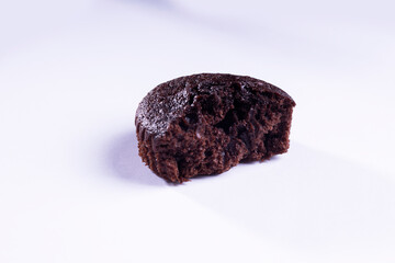 a half of plain dark chocolate cupcakes  on white background
