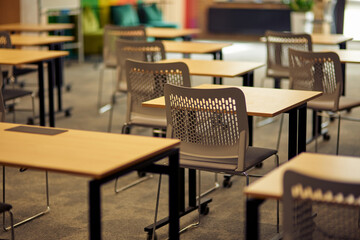 Empty classroom or conference room with desks and chairs