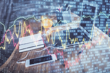 Financial market graph hologram and personal computer on background. Double exposure. Concept of forex.