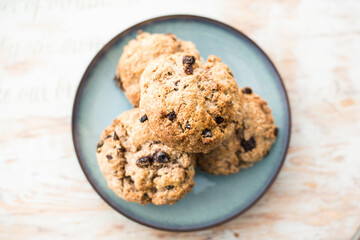 Fruit scones - freshly baked raisins and cinnamon scones on vintage plate