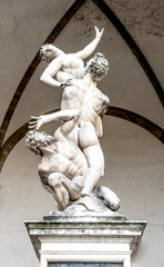 The Rape of the Sabine women, Renaissance sculpture by Giambologna, in the Loggia dei Lanzi building, located in Piazza della Signoria square in Florence, Tuscany, Italy