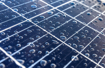 Solar panels on a construction site with raindrops on them