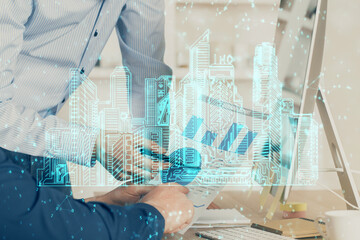High tech city drawing with businessman working on computer on background. Smartcity concept. Double exposure.