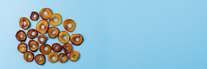 slices of dried plum on a blue background. dried fruits. eco.